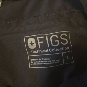 FIGs black pants stretch waist small slit at ankle and zippered back pockets